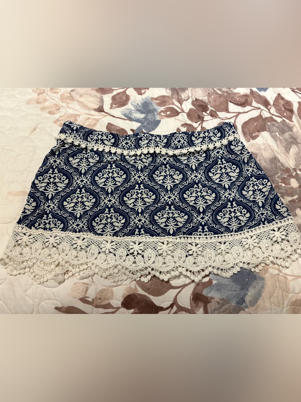 a navy blue and white damask-print mini skort